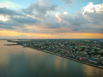 High angle view of buildings against sky during sunset