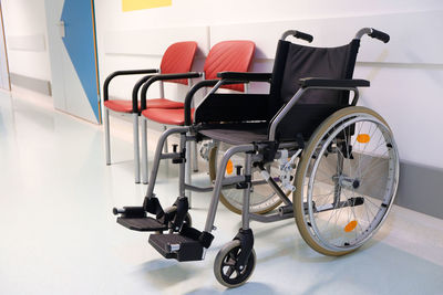 Wheelchair in a hospital corridor, close up