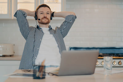 Man using laptop on table