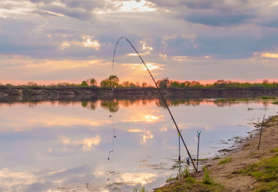 Scenic view of lake against sky during sunset