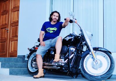 Man riding motorcycle on street