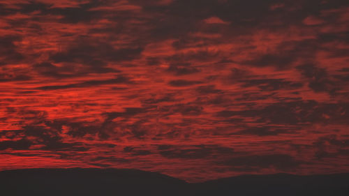 Low angle view of dramatic sky at sunset