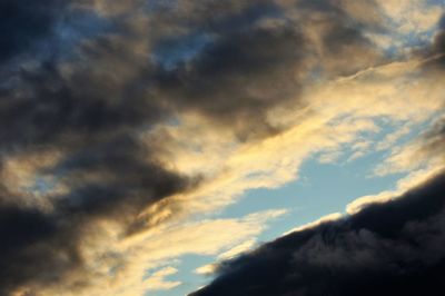 Low angle view of cloudy sky during sunset