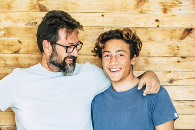 Smiling man looking at son