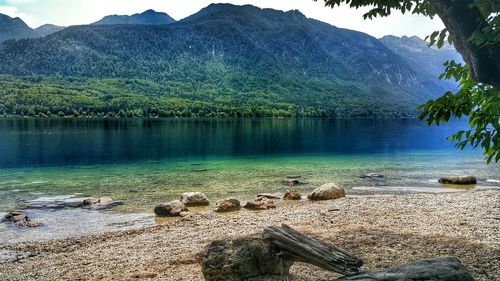 Scenic view of lake with mountains in background