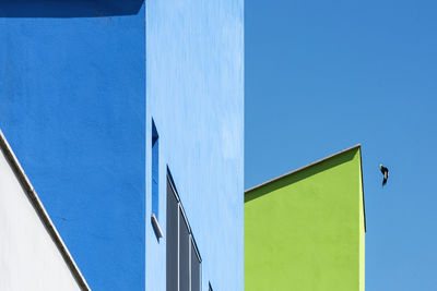 Low angle view of building against clear blue sky