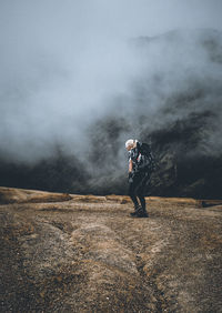 Full length of man standing on mountain