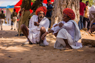 Group of people sitting outdoors