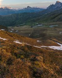 Scenic view of landscape and mountains against sky