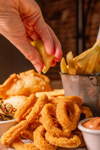 Cropped hand of person preparing food