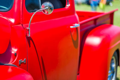 Close-up of red vintage car