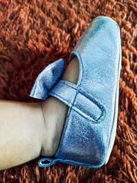 Low section of woman wearing shoes