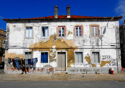 Exterior of old building in city against clear blue sky. lisbon portugal