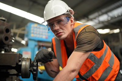 Side view of man working in gym