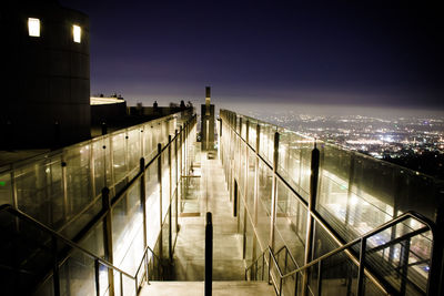 High angle view of illuminated buildings against sky at night