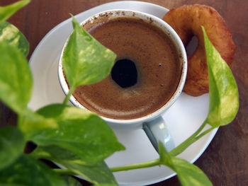 Close-up of coffee and spoon on table