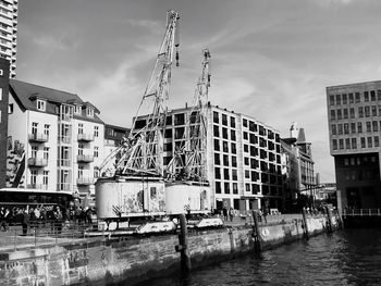 Panoramic view of buildings in city against sky