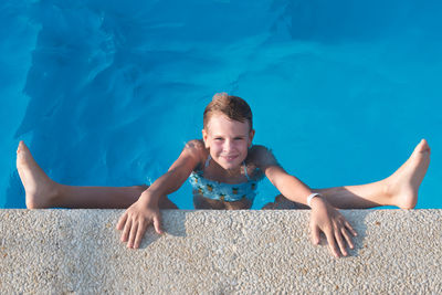 Portrait of boy in swimming pool