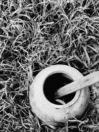 High angle view of abandoned tire on field