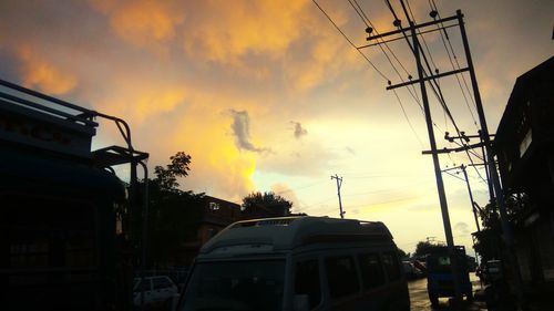 Low angle view of silhouette buildings against sky during sunset