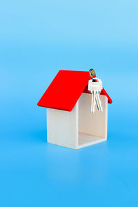 Close-up of red toy over white background