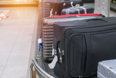 Close-up of luggage on conveyor belt in airplane