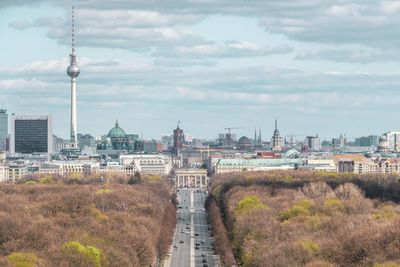 View of berlin cityscape against cloudy sky