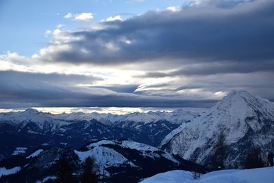 Scenic view of snowcapped mountains against sky