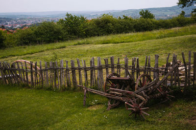 Wooden fence on grassy field