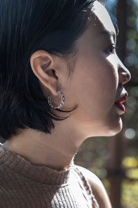 Close-up of young woman looking away