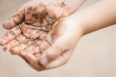 Close-up of person holding hands