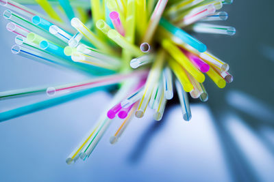 Close-up of colorful drinking straws on table