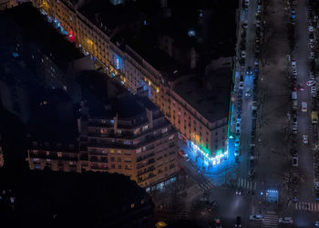 High angle view of buildings in city at night