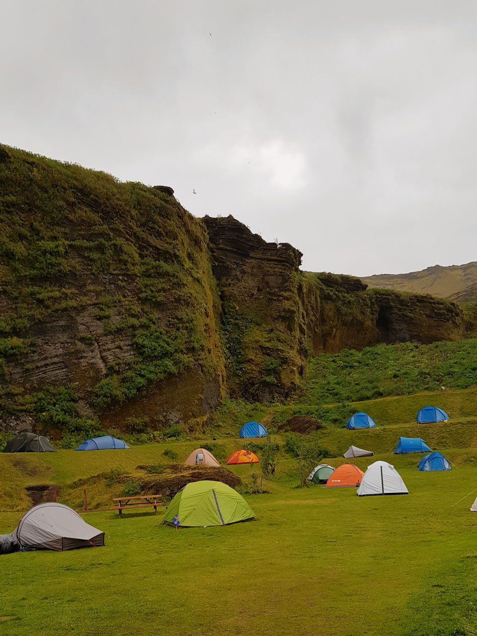 TENT ON FIELD AGAINST SKY