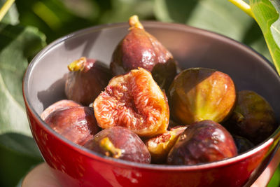 Fresh organic figs in a red bowl - close-up