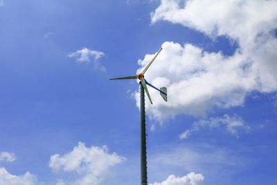 Low angle view of wind turbine against sky