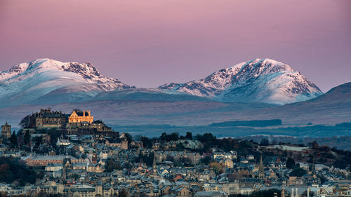 Stirling castle on a wintery scottish day just before sunrise hits the castle