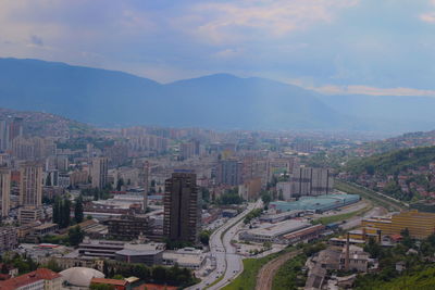 High angle view of buildings in city against sky