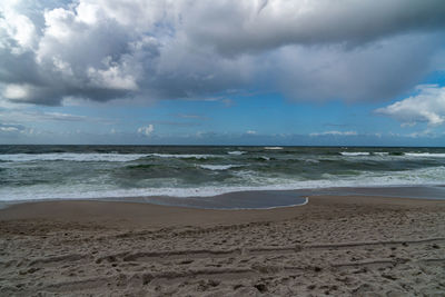 Scenic view of beach against sky