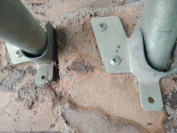 High angle view of man working on metal