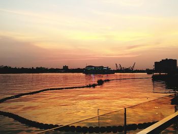 Scenic view of lake against sky during sunset