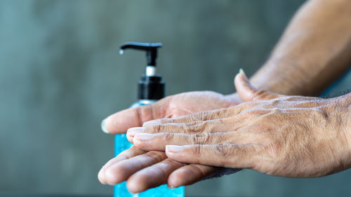 Close-up of man holding hands