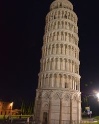 Low angle view of historical building at night