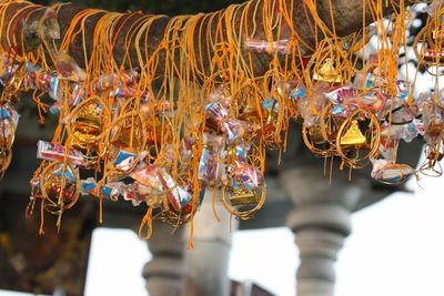 Close-up of decorations hanging at market stall