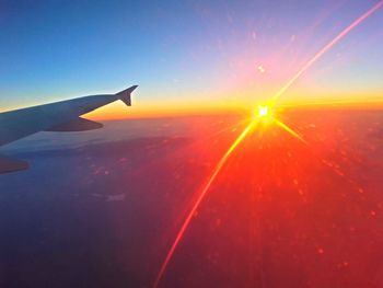 Cropped image of airplane flying over landscape