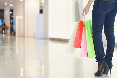 Low section of woman walking on floor