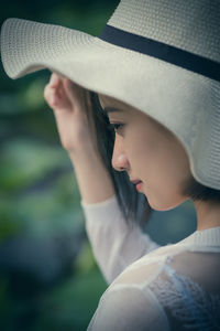 Close-up of woman wearing hat