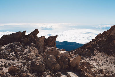 Scenic view of rocks in mountains against sky