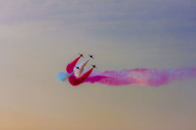 Low angle view of airshow in sky