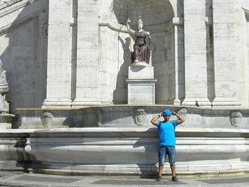 Full length of man photographing sculpture